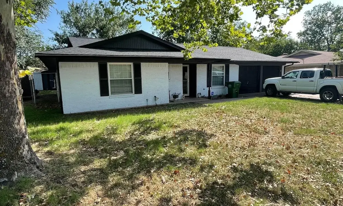 Professional roofing crew working on a residential roof in Woodland Park